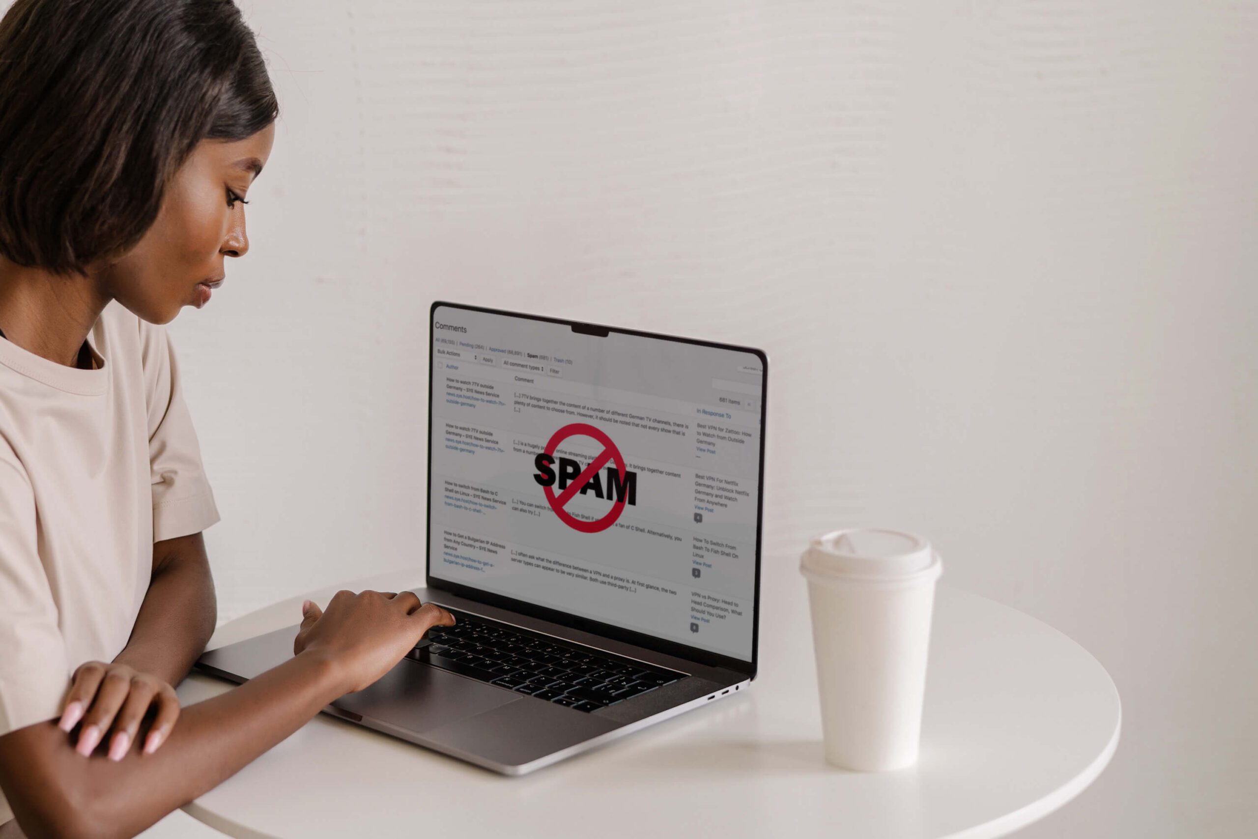 Woman looking at spam comments from her Showit website and WordPress blog